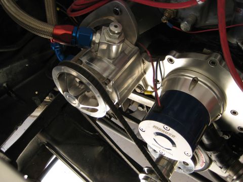 1979 Ford Bronco - Engine bay detail showing a polished pulley and a blue-capped Moroso part with visible wiring.