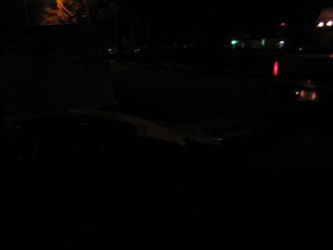 1988 Ford C-350 (Centurion Conversions) - A dimly lit scene shows the interior of a truck bed at night.