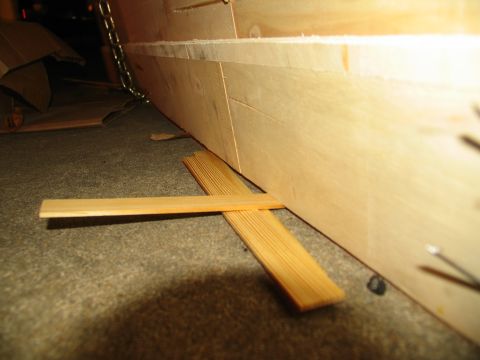1988 Ford C-350 (Centurion Conversions) - Close-up of wooden planks and a chain attached to a wooden structure.