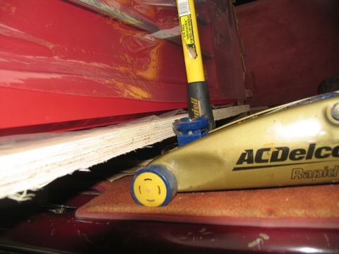 1988 Ford C-350 (Centurion Conversions) - An ACDelco Rapid jack is visible inside a vehicle, alongside a yellow handled tool.