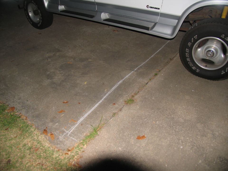 White van with silver trim and running boards, seen from the side. Text 'CENTURION' is visible on the body