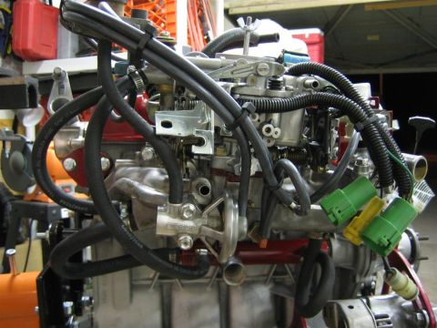 1987 Suzuki Samurai - This image shows a detailed view of an engine's fuel delivery system, including the carburetor and associated hoses.