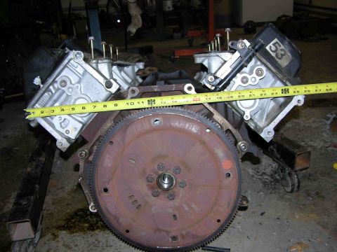 1997 Lincoln Town Car - Engine block and flywheel assembly, measured with a tape measure. A "53" tag is visible.