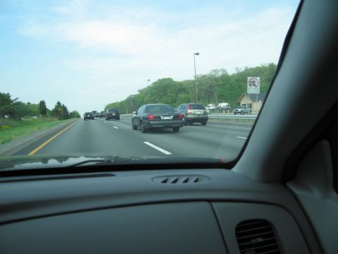 1991 Ford LTD Crown Victoria - A 1991 Ford Crown Victoria LTD is seen driving on a highway, with other vehicles in traffic.