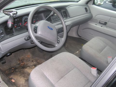 1991 Ford LTD Crown Victoria - Interior view of a 1991 Ford Crown Victoria LTD, showing the dashboard, steering wheel, and front seats.