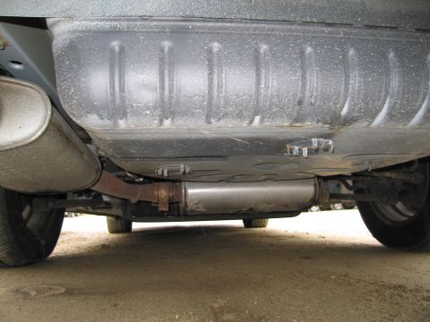 1991 Ford LTD Crown Victoria - The underside of a vehicle is visible, including the exhaust system and fuel tank.