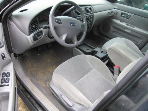 1991 Ford LTD Crown Victoria - The interior of a car is visible, the driver's side controls and passenger seats.