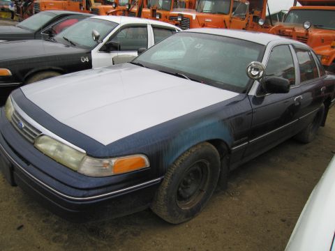 1991 Ford LTD Crown Victoria - Front 3/4 view of a 1991 Ford Crown Victoria LTD, showing its two-tone paint scheme.