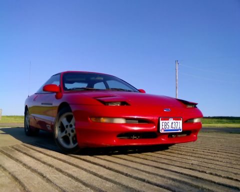 1993 Ford Probe - This red 1993 Ford Probe GT is shown from a low angle with the front three-quarter view.