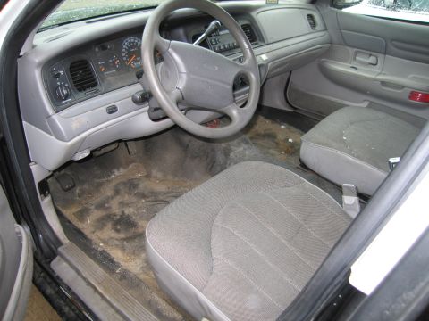 1991 Ford LTD Crown Victoria - Interior view of a 1991 Ford Crown Victoria LTD, showing the dashboard, steering wheel, and front seats.