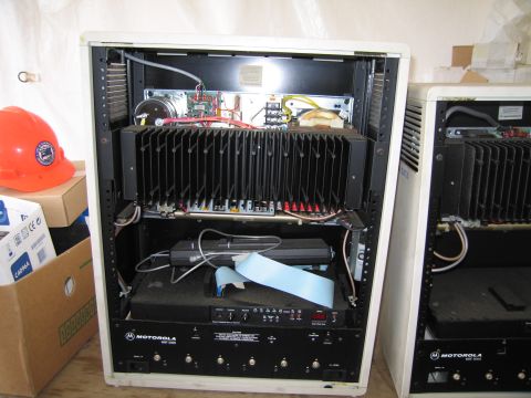 1991 Ford LTD Crown Victoria - Two open electronic equipment racks are shown, with one partially obscuring the other, revealing internal wiring and components.