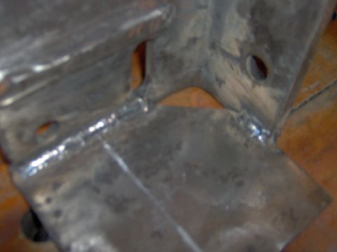 1993 Ford Bronco - Close-up of a metal bracket showing welded seams and mounting holes.