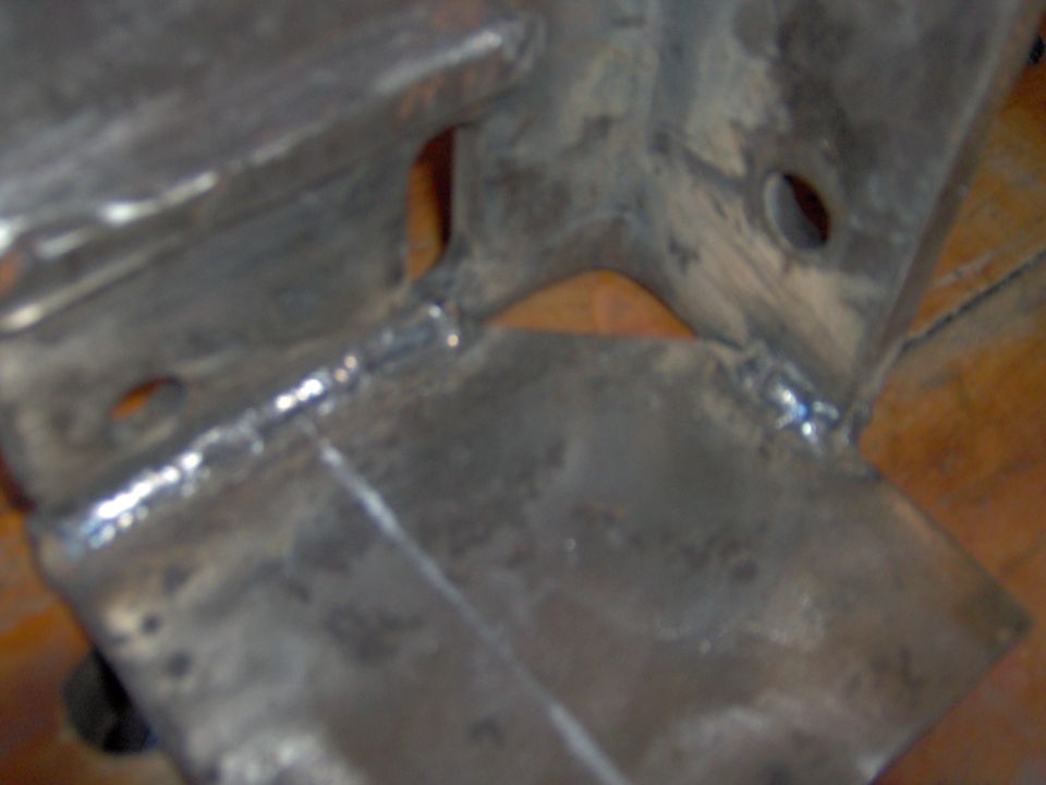 Metal bracket with visible welds and bolt holes