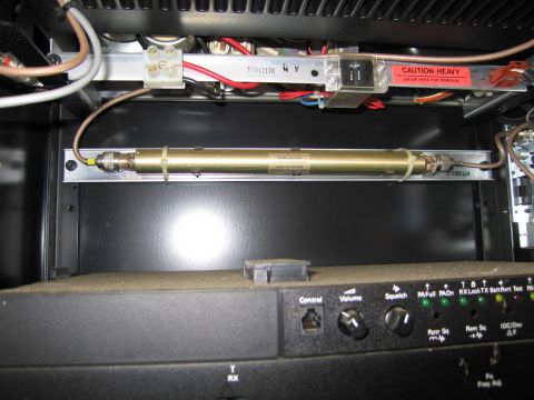1991 Ford LTD Crown Victoria - Internal view of electronic equipment, a component labeled 'MICRO-ON-AIR' and a control panel with various buttons and knobs.