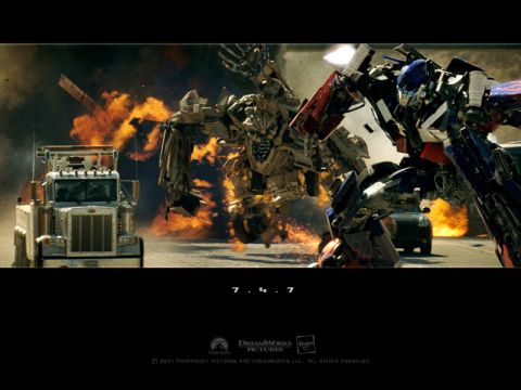 1985 Ford Bronco - Robots engage in battle amidst explosions and debris on a city street.