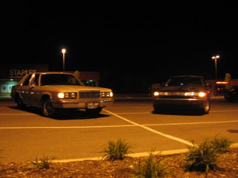 1988 Mercury Grand Marquis - A 1988 Mercury Grand Marquis is parked in a lot at night, with another vehicle visible to the right.