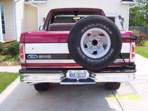 1994 Ford Bronco - This Ford Bronco features a two-tone paint scheme and a rear-mounted spare tire.