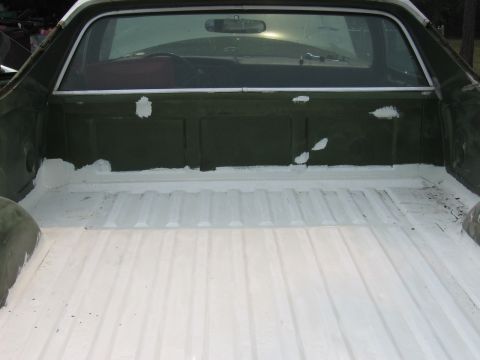 1973 Ford Ranchero - The bedliner of a 1973 Ford Ranchero has been painted white, with some areas showing primer.