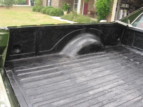 1973 Ford Ranchero - The bed liner of a 1973 Ford Ranchero is coated in black spray-on material.