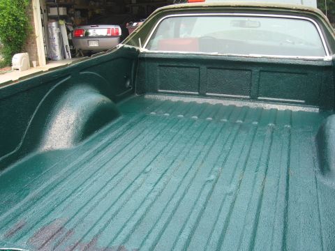 1973 Ford Ranchero - The bedliner of a 1973 Ford Ranchero has been coated with a dark green textured material.
