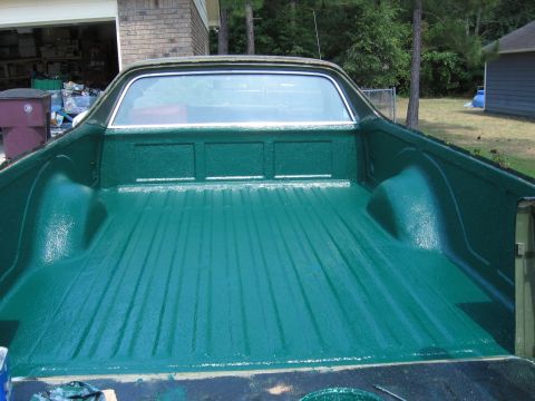 1973 Ford Ranchero - The bedliner of a 1973 Ford Ranchero has been painted a vibrant green.