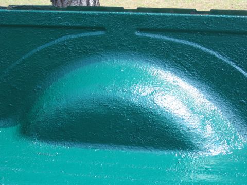 1973 Ford Ranchero - Close-up view of a green bedliner, highlighting the textured surface and the curve of the wheel well.