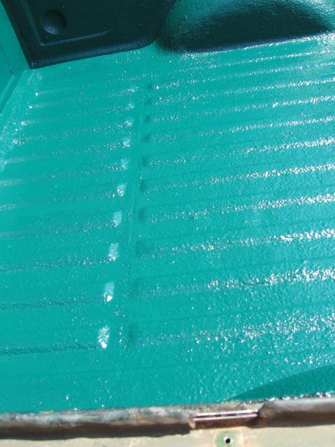 1973 Ford Ranchero - The textured surface of a newly painted truck bed liner is visible.