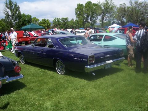 1972 Ford Ranchero - A classic Ford Galaxie 500 is displayed at an outdoor car show with other vehicles and attendees.