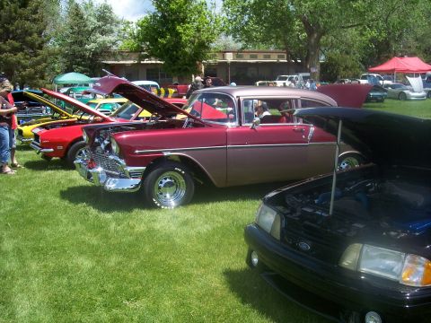 1972 Ford Ranchero - Classic cars on display at an outdoor event, with multiple vehicles showing their engines.