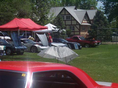 1972 Ford Ranchero - A red 1972 Ford Ranchero is displayed with its hood open at an outdoor car show.