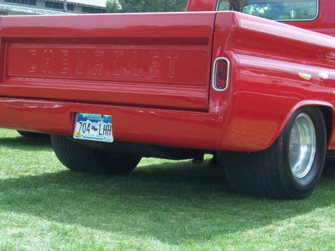 1972 Ford Ranchero - The tailgate of a red Chevrolet pickup truck is visible, with a Colorado license plate.