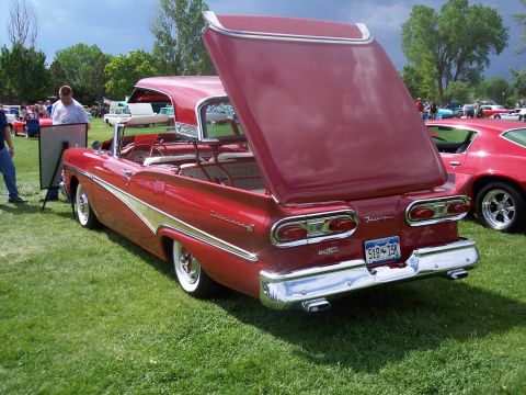 1972 Ford Ranchero - A red 1957 Ford Fairlane convertible is displayed with its hood and trunk open at a car show.