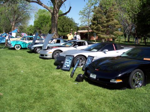 1972 Ford Ranchero - A car show displays various vehicles, with a black Corvette prominently featured in the front.