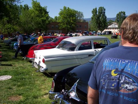 1972 Ford Ranchero - Classic cars lined up at an outdoor show, with a white 1955 Ford Fairlane Crown Victoria prominently featured.
