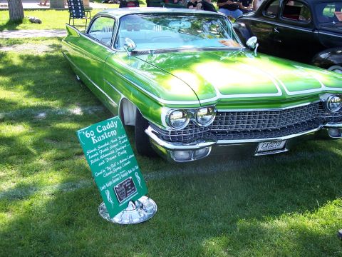 1972 Ford Ranchero - A lime green 1960 Cadillac Kustom is displayed on a grassy lawn next to a sign detailing its custom features and ownership.