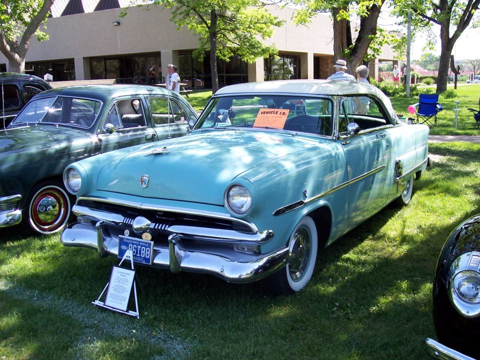 Light blue two-tone coupe with chrome accents and whitewall tires