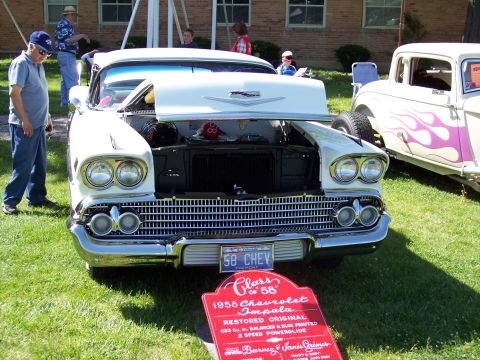 1972 Ford Ranchero - A sign in front of the 1958 Chevrolet Impala details its restoration and specifications.