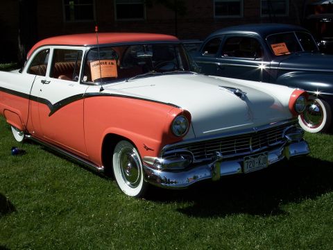1972 Ford Ranchero - A classic two-tone coral and white 1955 Ford Fairlane Crown Victoria is displayed on a grassy lawn.