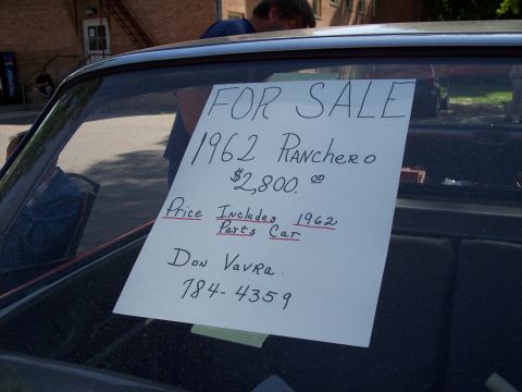 1972 Ford Ranchero - A sign advertises a 1962 Ranchero and a 1962 parts car for sale.