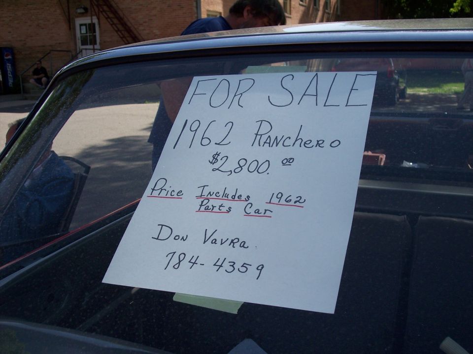 Handwritten For Sale sign on a windshield for a 1962 Ranchero