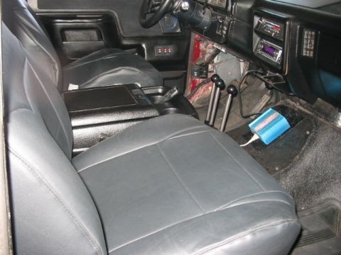 1991 Ford Bronco - Interior view of a truck's cabin, focusing on the seats and dashboard area.