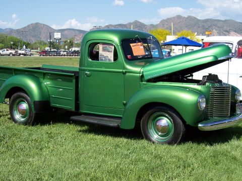 1972 Ford Ranchero - This 1947 International KB-5 pickup truck is displayed with its hood open at a car show.