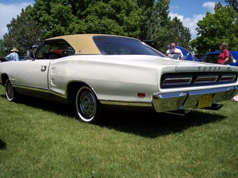 1972 Ford Ranchero - Rear view of a 1970 Dodge Coronet with a tan vinyl roof, parked on grass at a car show.