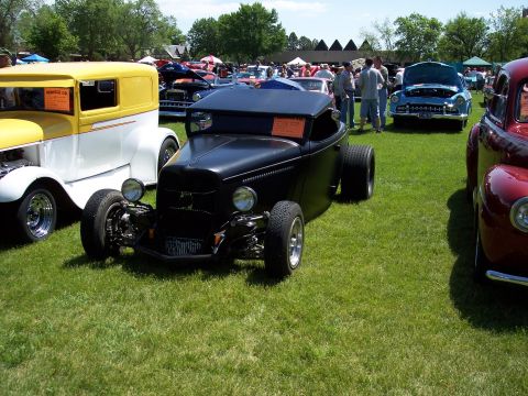 1972 Ford Ranchero - Hot rod on display at a car show with multiple vehicles and spectators present.