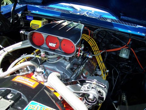 1972 Ford Ranchero - Customized engine bay a prominent NOS intake system and polished chrome components.
