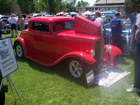 1972 Ford Ranchero - Custom 1932 Ford coupe hot rod displayed at a car show with other vehicles and spectators.