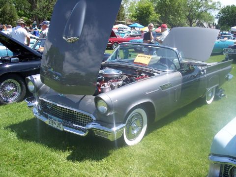 1972 Ford Ranchero - A gray 1957 Ford Thunderbird convertible is displayed with its hood open at a car show.