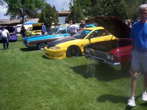 1972 Ford Ranchero - Multiple vehicles are displayed on a grassy field at an outdoor car show.