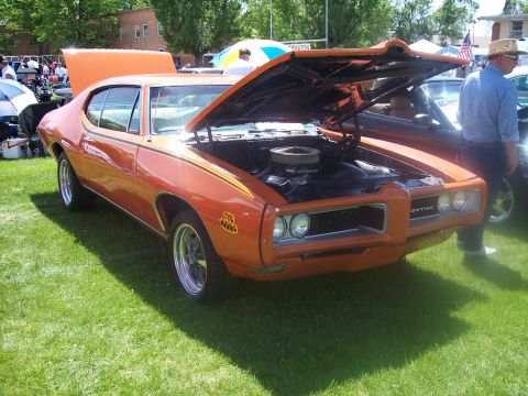 1972 Ford Ranchero - 1970 Pontiac GTO on display at a car show.