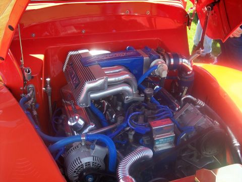1972 Ford Ranchero - A highly customized engine bay is visible with bright blue hoses and polished chrome parts.